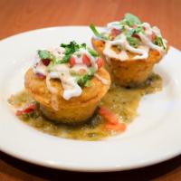 Jalapeno Tamale Corn Bread · 2 corn cakes on tomatillo sauce and topped with chipotle ranch, avocado, sour cream, tomatoe...