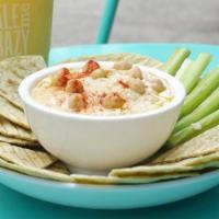 Mediterranean Hummus Salad · House-made hummus topped with: cucumbers, olives, pickled red onions, feta, scallion mix and...