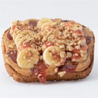 PB & Chia Jam Toast · Whole Grain Bread, Peanut Butter, Sliced Banana, Strawberry Chia Jam, Granola.