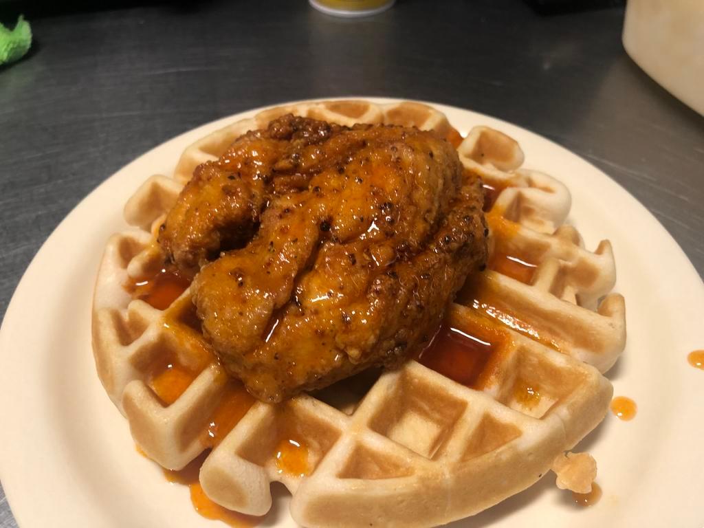 Chicken and Waffle Breakfast · Fried chicken breast and a Belgian waffle drizzled with honey hot sauce.