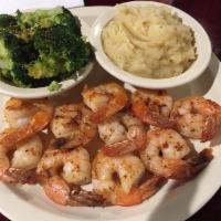 Grilled Shrimp Dinner · 2 skewers of grilled shrimp served with a side of steamed broccoli and mashed potatoes.