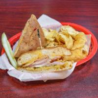 Cuban Sandwich  · Turkey, ham, Swiss cheese, sliced pickles, with 1000 Island dressing, brown mustard, on Cuba...