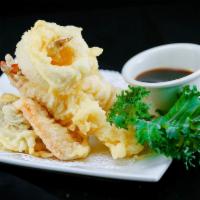 Crispy Calamari · Hand battered deep fried squid served with sweet chili sauce.