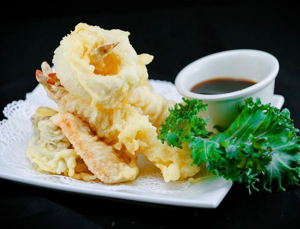 Crispy Calamari · Hand battered deep fried squid served with sweet chili sauce.