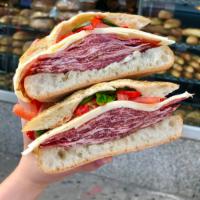 #8. Stallion Sandwich · Imported coppa, provolone, tomato, basil, roasted peppers with olive oil on rosemary focaccia.