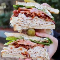 #23. Club Sandwich · Turkey, bacon, lettuce, tomato, mayo on sliced bread.