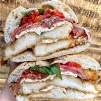 #H16. Sinatra Sandwich · Breaded chicken, 2 slices of prosciutto, fresh mozzarella, tomato, roasted peppers & basil o...