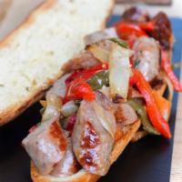 #H20.  Sausage & Peppers Sandwich · Sausage and peppers with sautéed onions on hero.