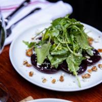 Roasted Beets · Poached pear, candied walnuts, Gorgonzola, greens and lemon-thyme dressing.