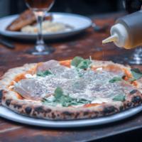 Prosciutto Pizza · Tomato sauce, arugula and Parmigiano-reggiano.