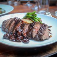 Hanger Steak · Cherry mostarda and roasted parmigiano potatoes.