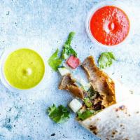 The Wrap · Comes with Garlic Yogurt, Greens, Tomato, Cucumber, and Pickled or Raw Onions. Choose A Prot...
