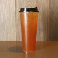 Oolong Passion Fruit Peach Tea · House made floral and light tea with a passionfruit tang and peach sweetness. 24oz.