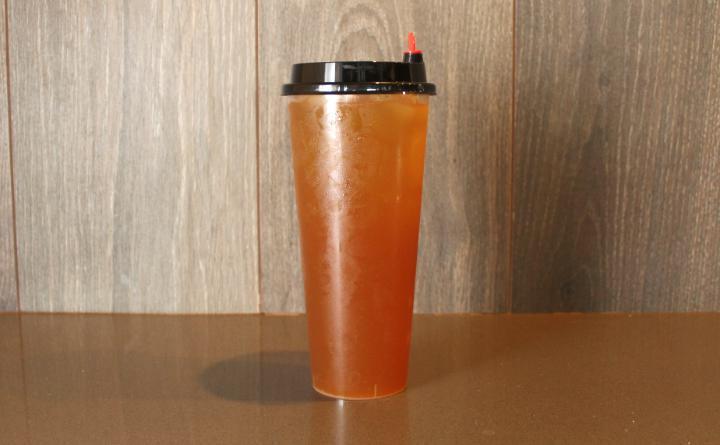 Oolong Passion Fruit Peach Tea · House made floral and light tea with a passionfruit tang and peach sweetness. 24oz.