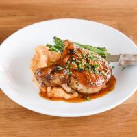 Pork chop   · Pork chop, green beans,chipotle mashed potatoes and passion fruit glaze.