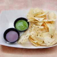 Chips and Chutney · Papadum chips made with chickpea lentil and rice flour. Served with our signature cilantro-m...