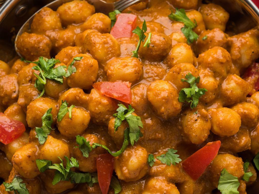 Chana Masala (VEGAN) · Chickpeas stir fried in an authentic masala made up of onions, ginger , turmeric, cumin, fresh tomato's and herbs. Chana Masala will be accompanied with a side of Supreme Long Grain Basmati Rice. This Entree is Gluten Free
