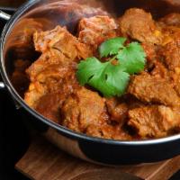 LAMB CURRY* · Chunks of Boneless Leg of Lamb slowly cooked in an authentic spicy curry sauce made of whole...