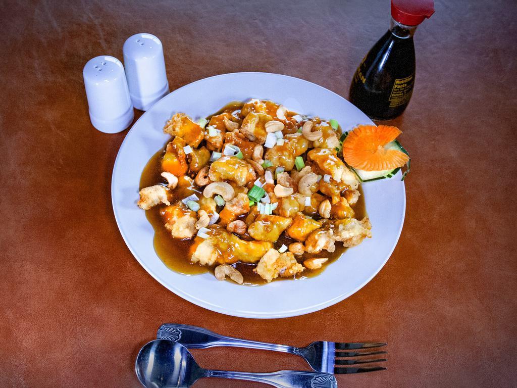 Cashew Chicken · Diced chicken, bamboo shoots, water chestnuts, celery, carrots, cashew in brown sauce.