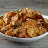 GARLIC PARMESAN CHIPS · Housemade potato chips tossed in our signature garlic Parmesan sauce