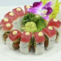 Crunchy Spicy Tuna Roll · Spicy tuna, tempura flake, avocado and sesame seeds with tuna on top. Spicy.