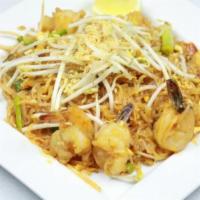Shrimp Pad Thai Noodle · Rice noodles sauteed with egg, scallions, ground roasted peanuts, bean sprouts and pad Thai ...