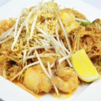 Seafood Pad Thai Noodle · Combination of shrimp, mussels, squid ,scallops, and 1/2 lobster tail. Rice noodles sauteed ...