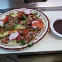 Poc-Chuc Plate · Shredded cabbage marinated with lime and salt. Topped with tomatoes , cilantro , radishes, a...