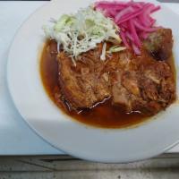 Cochinita Pibil Plate · Slowly roasted marinated pork chucks served with cabbage and red pickled onions