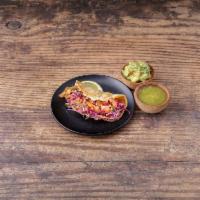 Mexican Pulled Pork Taco · Avocado sauce. Served on authentic homemade nixtimal corn tortillas. Topped with pico-de-gal...