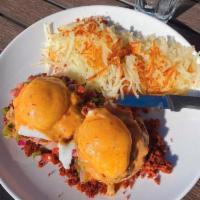 Southwestern Benedict · Chorizo sausage, roasted red peppers, poached eggs, chipotle hollandaise, pico de gallo, and...