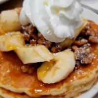 Banana Nut Pancake · Topped with candied walnuts and bananas. Drizzled with caramel sauce.