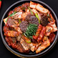 Stir-fried Blacksausage with veggies, rice cakes · 철판 순대떡볶음