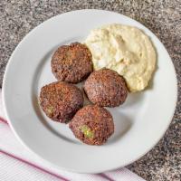 Falafel Patties and Humus · Fried ball made from beans. 