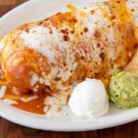 Wet Burrito · Flour tortilla stuffed with shredded beef or chicken, beans, rice, lettuce and pico de gallo...