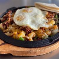 Alambre de Chorizo (Chorizo Breakfast Skillet) · A Mexican dish made of potatoes, bell peppers, onions, two eggs of any style, cheese, and ch...