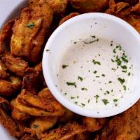 Artichoke Hearts · Artichoke hearts fried in Italian bread crumbs.  Served with a side of our homemade ranch dr...