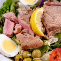 Grilled Tuna Salad · Harvest mix lettuce, boiled egg, tomatoes, green and black olives and grilled tuna topped wi...