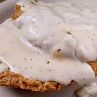 Country Fried Steak · Country fried steak topped with white pepper gravy. Served with your choice of side and a sa...