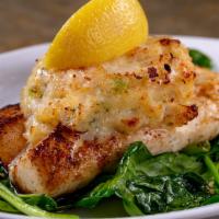 Mahi-Mahi Marliene · Pan seared Mahi topped with a stuffing of crabmeat, shrimp and scallops served over a bed of...