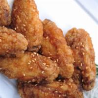 Chicken Wing Karaage · Crispy chicken wings and sweet soy sauce.