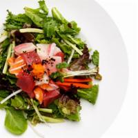 Sashimi Salad · Tuna, salmon, yellowtail, cucumber, daikon, spring mix, ponzu sauce and sesame oil.