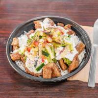 Lamb Bowl · Grilled lamb gyro served over seasoned basmati rice, topped with our veggie mix, tzatziki an...