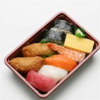 Moriawase · 9 pieces. Made with ahi nigiri, ika nigiri, ebi nigiri, salmon nigiri, egg nigiri, futomaki ...