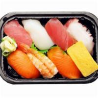 Nigiri · 8 pieces. Made with ahi, salmon, tako, ika, ebi, and unagi, egg, and shrimp.