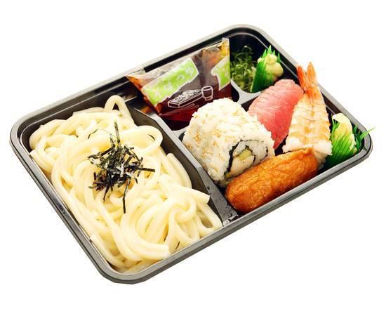 Sushi Udon Set · A set of cold udon noodles with tsuyu (soup), green onions, nori, California maki, ahi nigiri, ebi nigiri and inari, shrimp-nigiri, and wasabi.