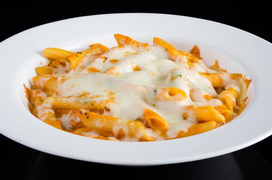Baked Ziti · Penne Pasta baked in tomato sauce and ricotta cheese with a melted mozzarella crust.