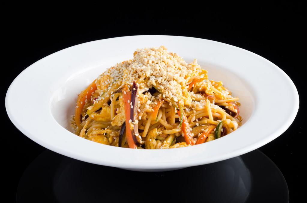 Stir Fried Pad Thai · Mixed vegetables stir-fried in scrambled eggs and noodles, seasoned with house sauce and topped with crushed peanuts and sesame.
