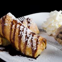 Cheese Raisin Blintzes · Served with chocolate syrup, powder sugar. Served with ice cream and whipped cream.