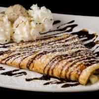 French Crepe · Filled with vanilla flan and hazelnut chocolate spread topped with chocolate, powdered sugar...